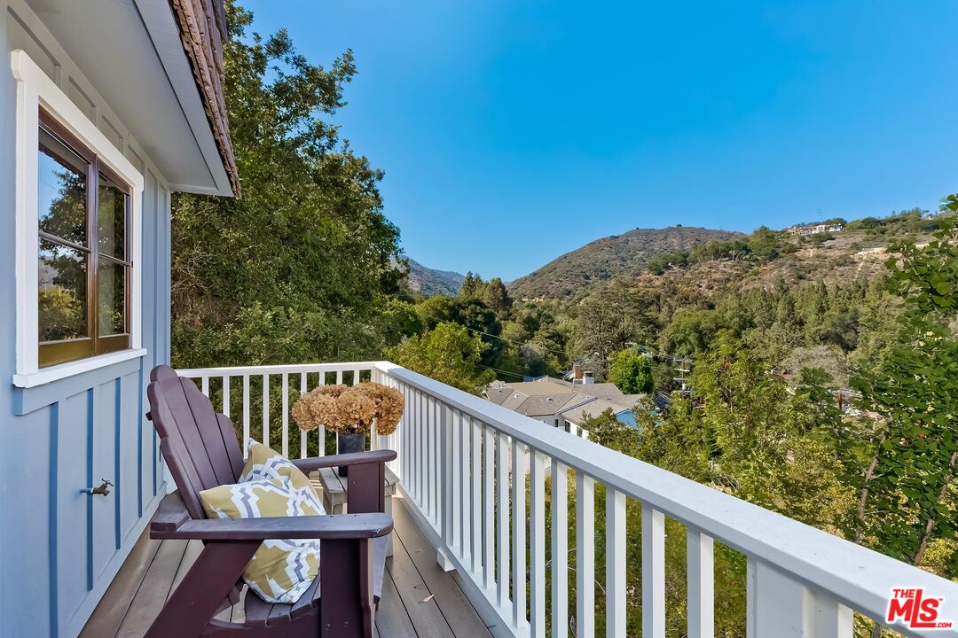 13240 Chalon Road Los Angeles, CA 90049 - Photo 37 of 46 a view of a balcony with furniture
