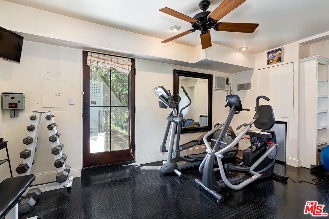 13240 Chalon Road Los Angeles, CA 90049 - Photo 40 of 46 a view of a room with gym equipment