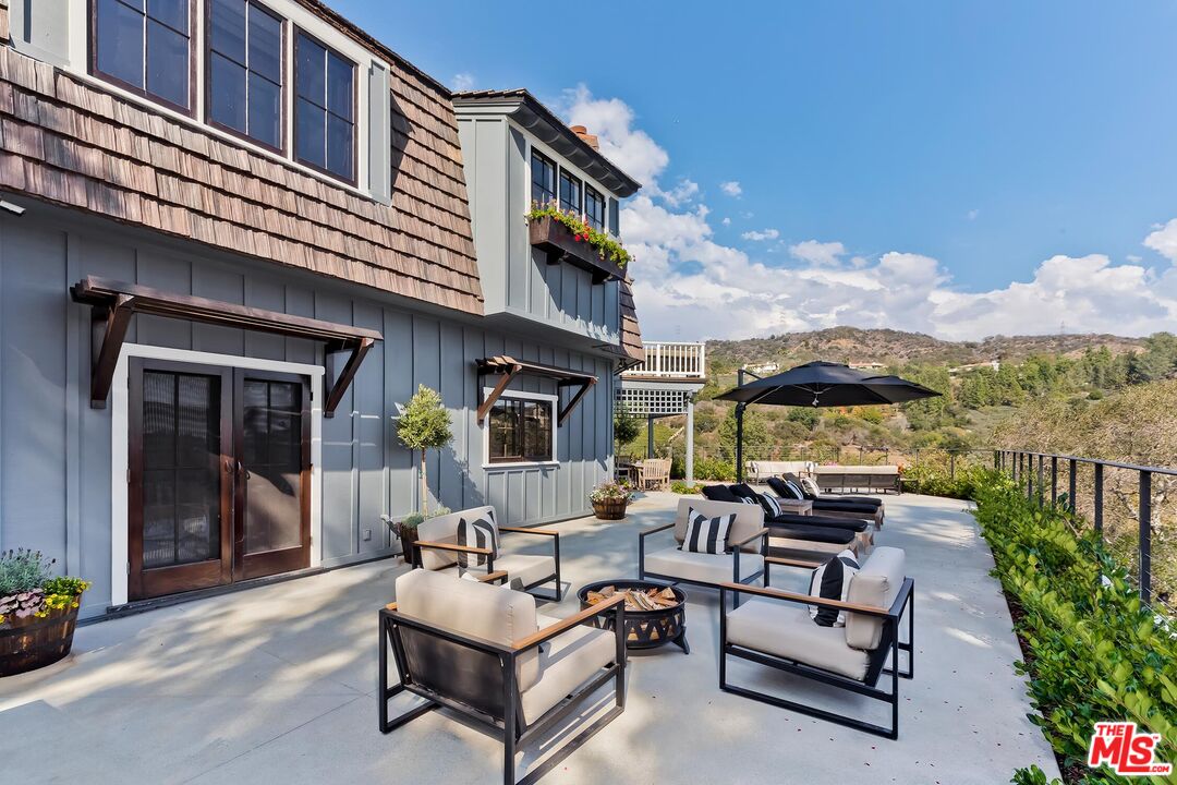 13240 Chalon Road Los Angeles, CA 90049 - Photo 4 of 46 a building outdoor space with patio furniture