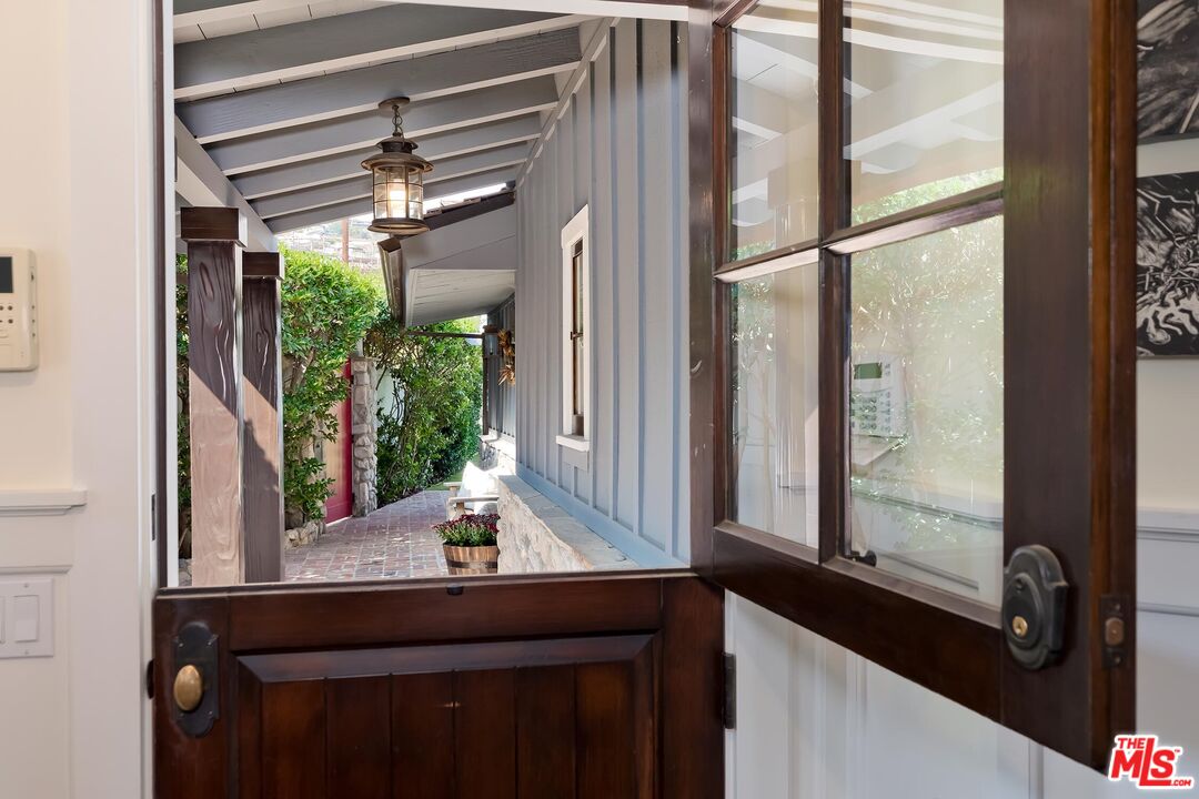13240 Chalon Road Los Angeles, CA 90049 - Photo 42 of 46 a bathroom with a window sink and mirror