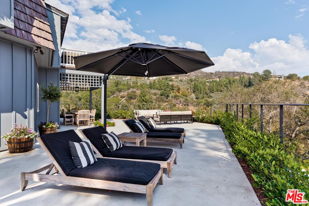 13240 Chalon Road Los Angeles, CA 90049 - Photo 5 of 46 a view of balcony with furniture
