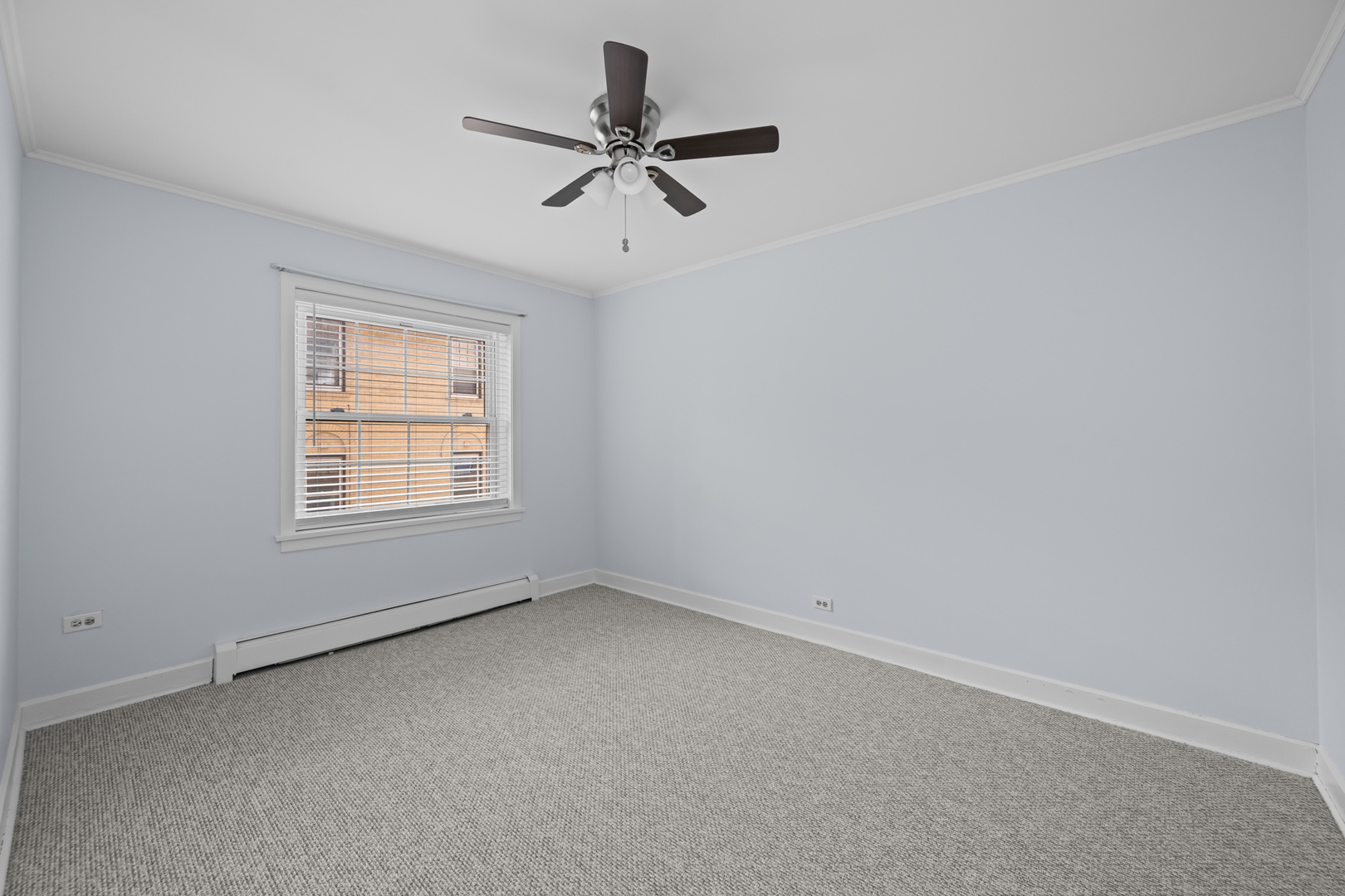 340 Ridge Avenue, Unit 1 Evanston, IL 60202 - Photo 12 of 16 an empty room with a window and a fan