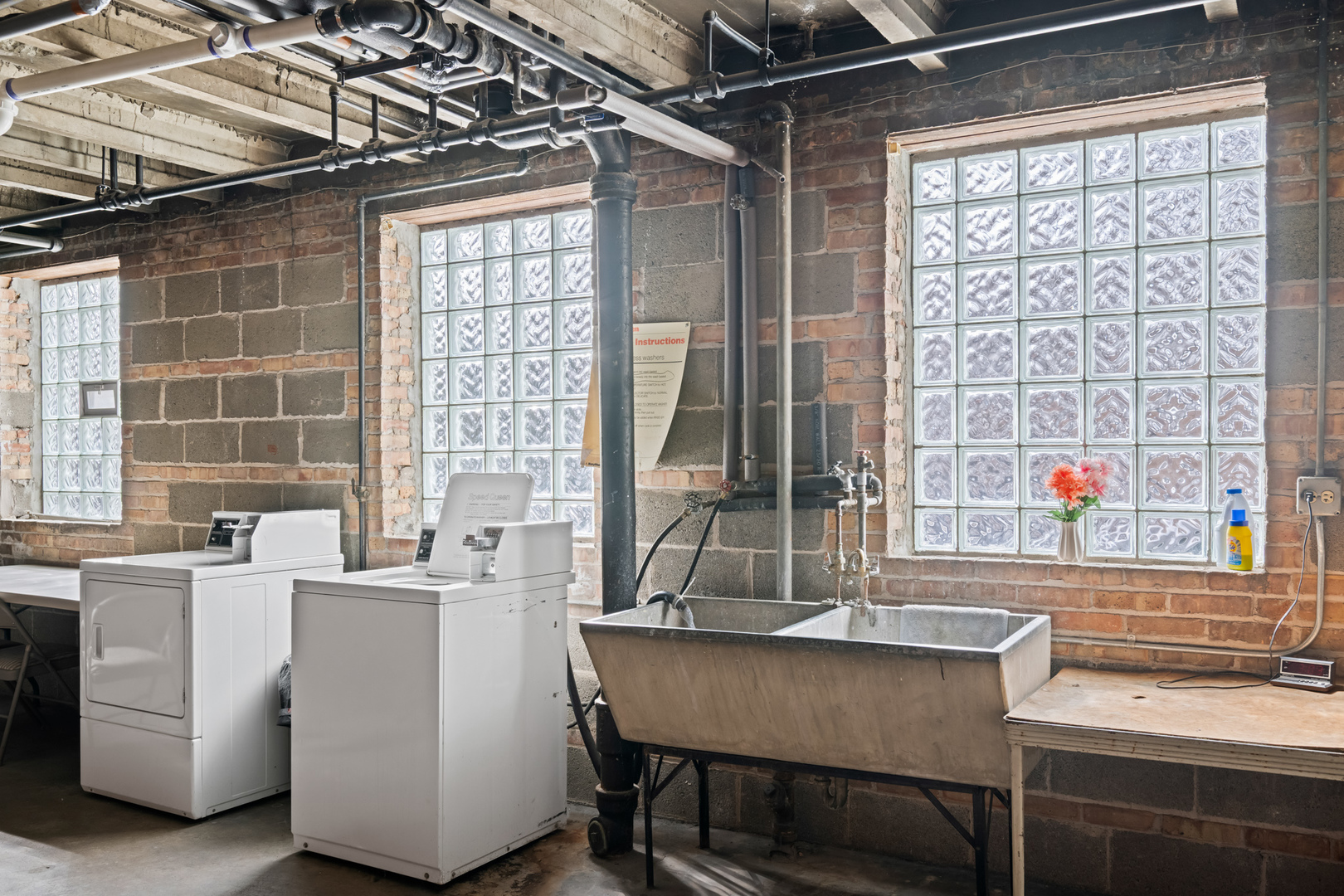 340 Ridge Avenue, Unit 1 Evanston, IL 60202 - Photo 15 of 16 a kitchen with a sink and a table
