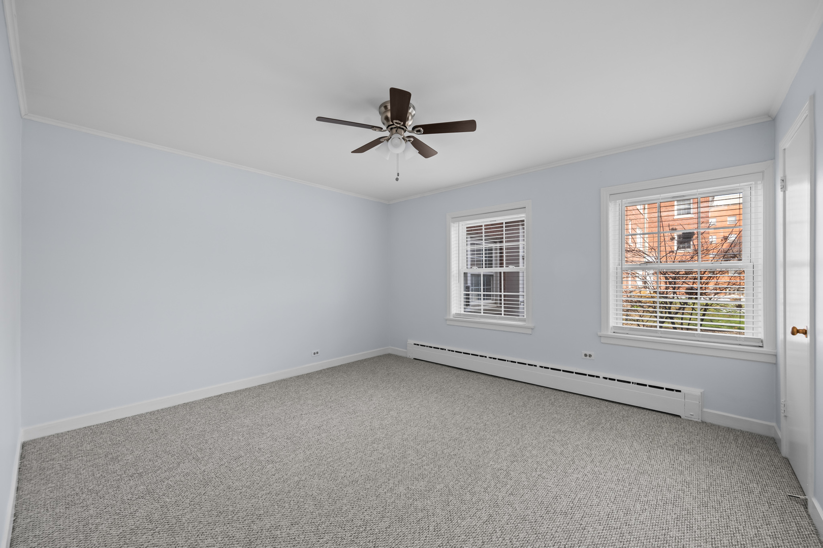 340 Ridge Avenue, Unit 1 Evanston, IL 60202 - Photo 10 of 16 an empty room with chandelier fan and windows
