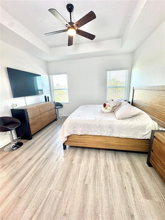 1301 Wycliffe Way St. Cloud, FL 34771 - Photo 12 of 50 a bedroom with bed window and couch