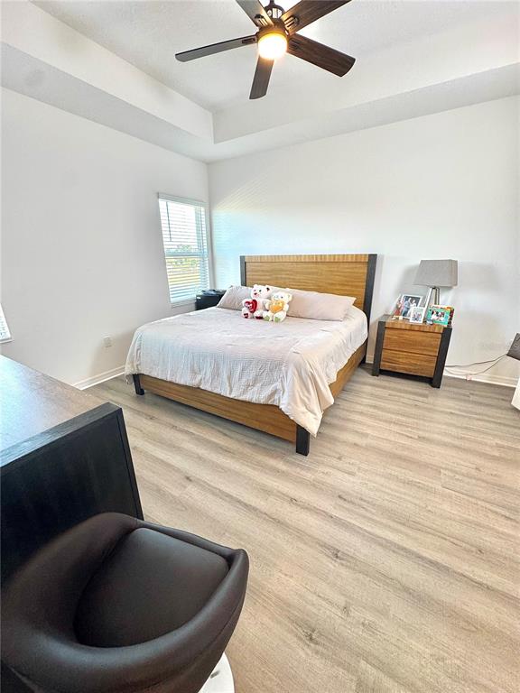 1301 Wycliffe Way St. Cloud, FL 34771 - Photo 13 of 50 a spacious bedroom with a bed and window