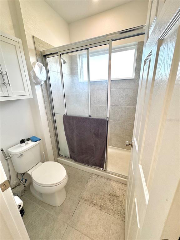 1301 Wycliffe Way St. Cloud, FL 34771 - Photo 14 of 50 a bathroom with a toilet and a shower
