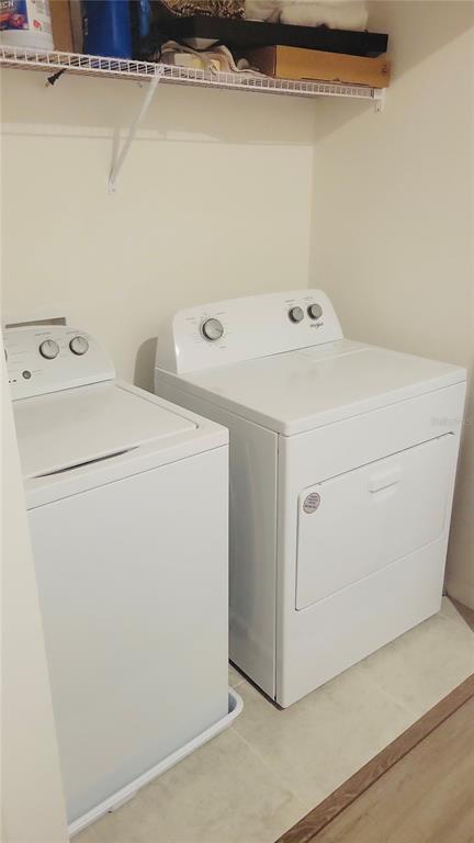 1301 Wycliffe Way St. Cloud, FL 34771 - Photo 18 of 50 a utility room with dryer and washer