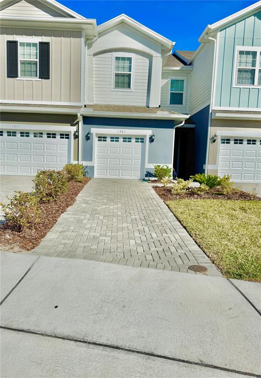 1301 Wycliffe Way St. Cloud, FL 34771 - Photo 2 of 50 a front view of a house with a yard