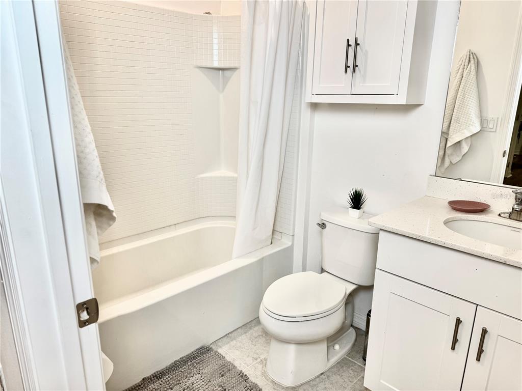 1301 Wycliffe Way St. Cloud, FL 34771 - Photo 23 of 50 a bathroom with a sink a toilet and shower