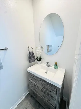 a spacious bathroom with a double vanity sink and a mirror