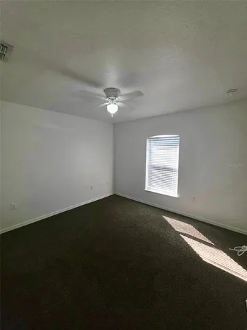 an empty room with a empty space and a window