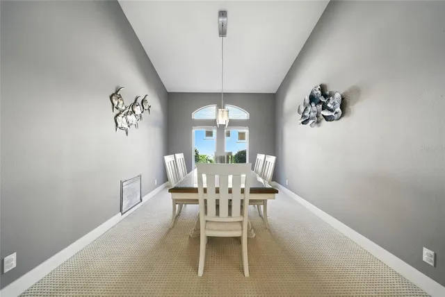 a living room with stainless steel appliances kitchen island granite countertop furniture and a view of kitchen