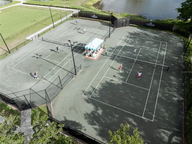 a view of a livingroom with dinning table and chairs