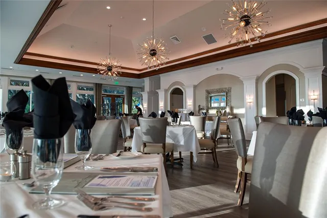 a view of a lake with houses in the back