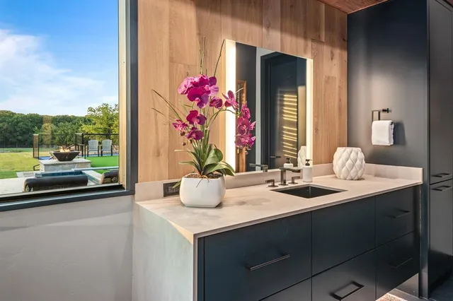 a dining room with furniture and a potted plant