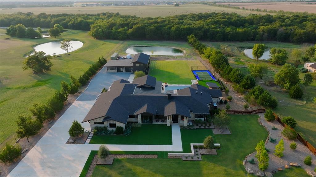 988 English Road Rockwall, TX 75032 - Photo 2 of 40 an aerial view of a house with outdoor space swimming pool