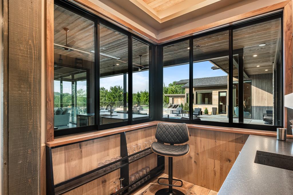 988 English Road Rockwall, TX 75032 - Photo 26 of 40 a view of a living room and floor to ceiling window with an outdoor seating