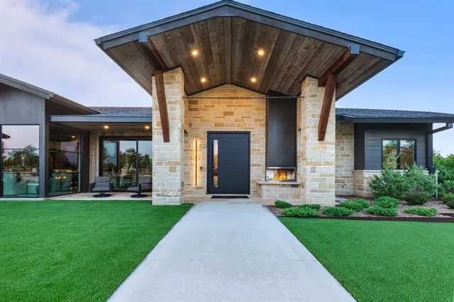 a front view of a house with a yard and porch
