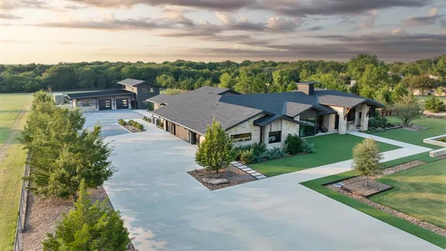 an aerial view of a house with a garden