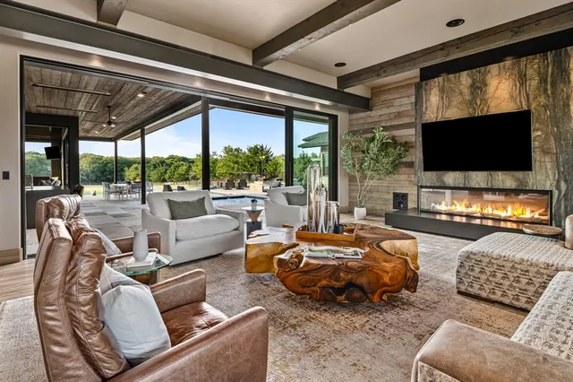a bedroom with furniture and a flat screen tv
