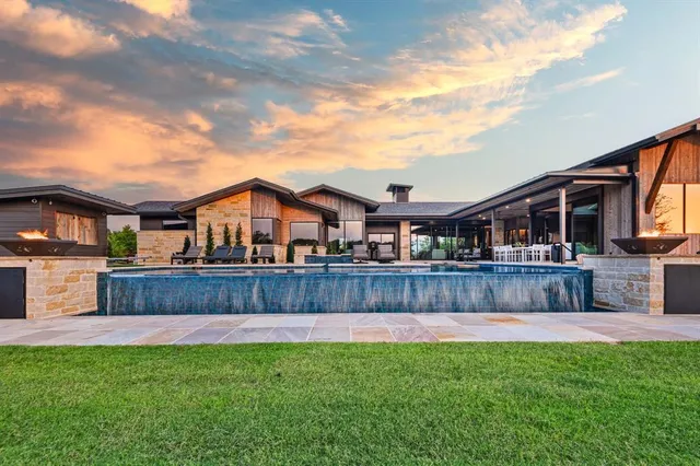 a front view of house with yard and outdoor seating
