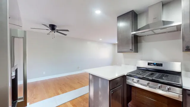 a kitchen with a stove and a refrigerator