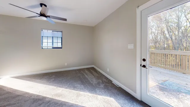 a view of an empty room with a window