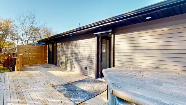 a bathroom with a granite countertop sink and a shower