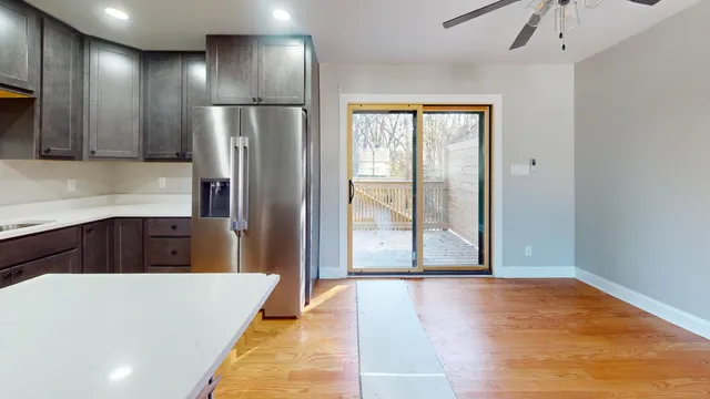 a kitchen with stainless steel appliances a refrigerator and a sink