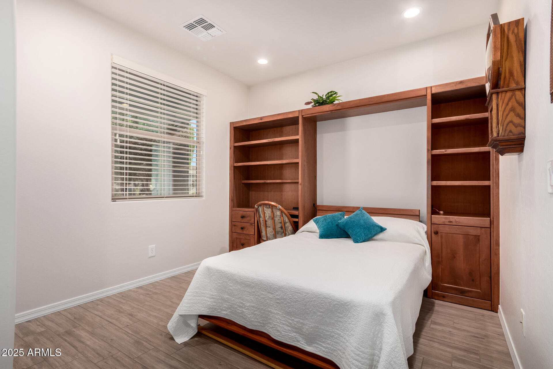 7253 West Cinder Brook Way Florence, AZ 85132 - Photo 13 of 72 a bedroom with a bed and a window