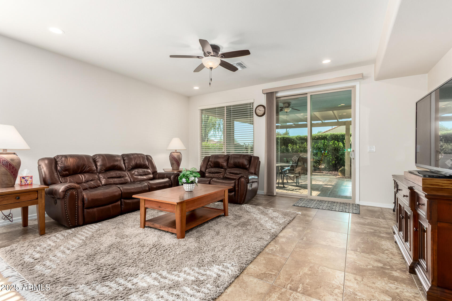 7253 West Cinder Brook Way Florence, AZ 85132 - Photo 15 of 72 a living room with furniture and a large window