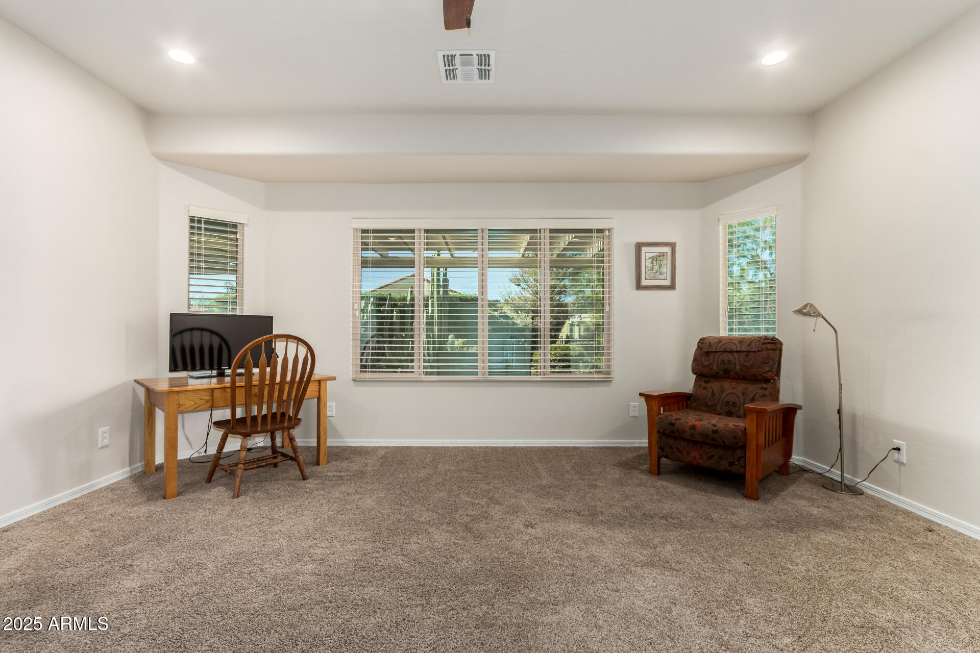 7253 West Cinder Brook Way Florence, AZ 85132 - Photo 23 of 72 a living room with furniture and a window