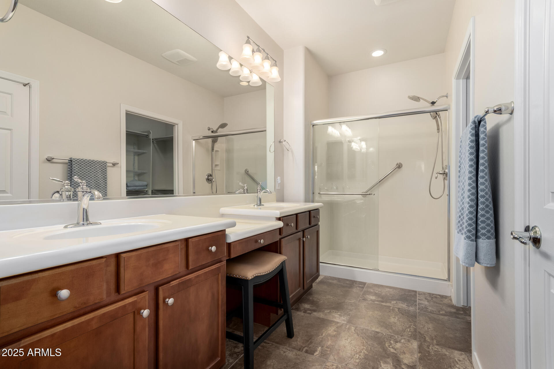 7253 West Cinder Brook Way Florence, AZ 85132 - Photo 25 of 72 a bathroom with a double vanity sink mirror and shower