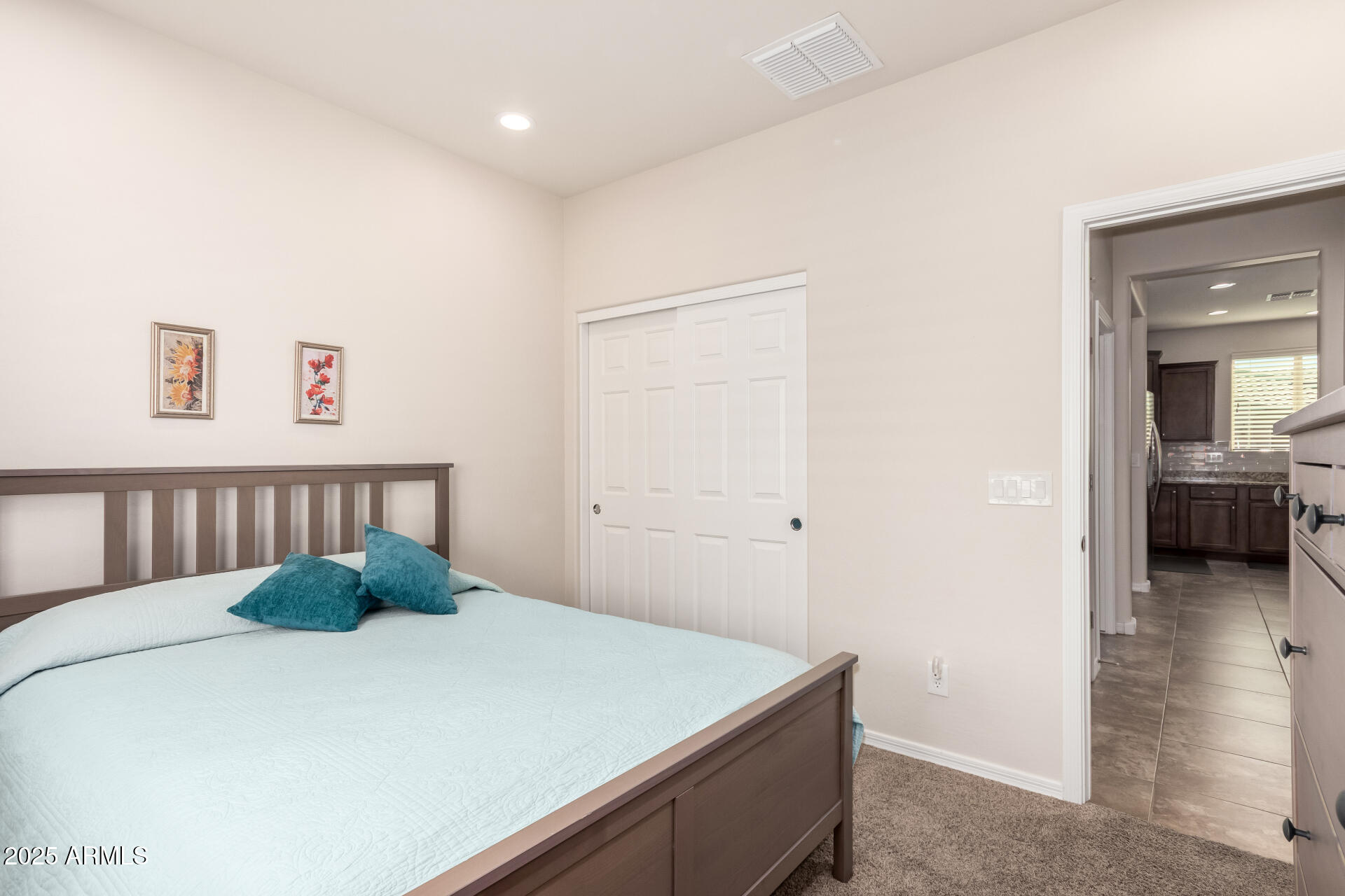 7253 West Cinder Brook Way Florence, AZ 85132 - Photo 28 of 72 a bedroom with a bed and a large mirror