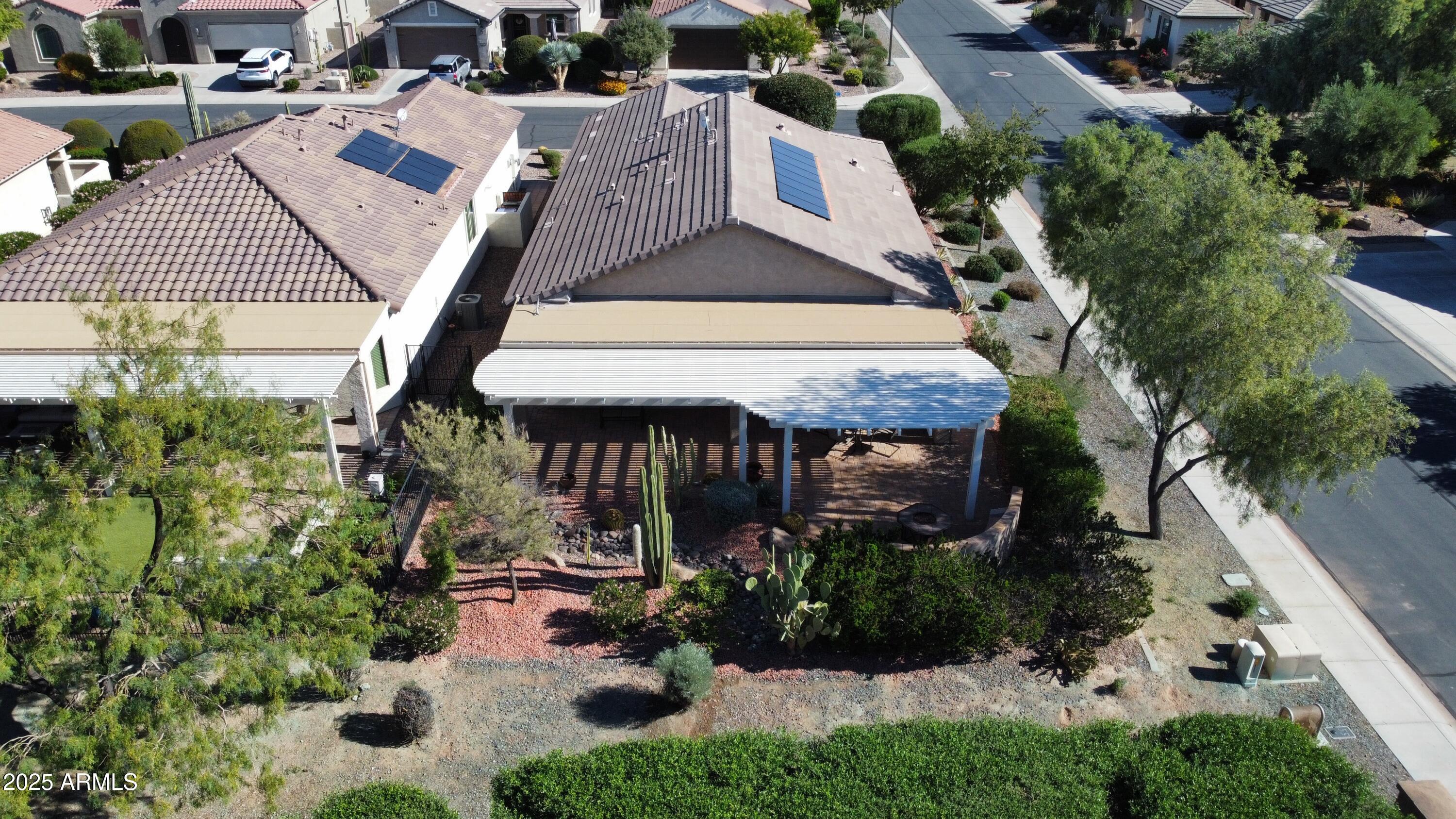 7253 West Cinder Brook Way Florence, AZ 85132 - Photo 34 of 72 an aerial view of a house with yard and patio