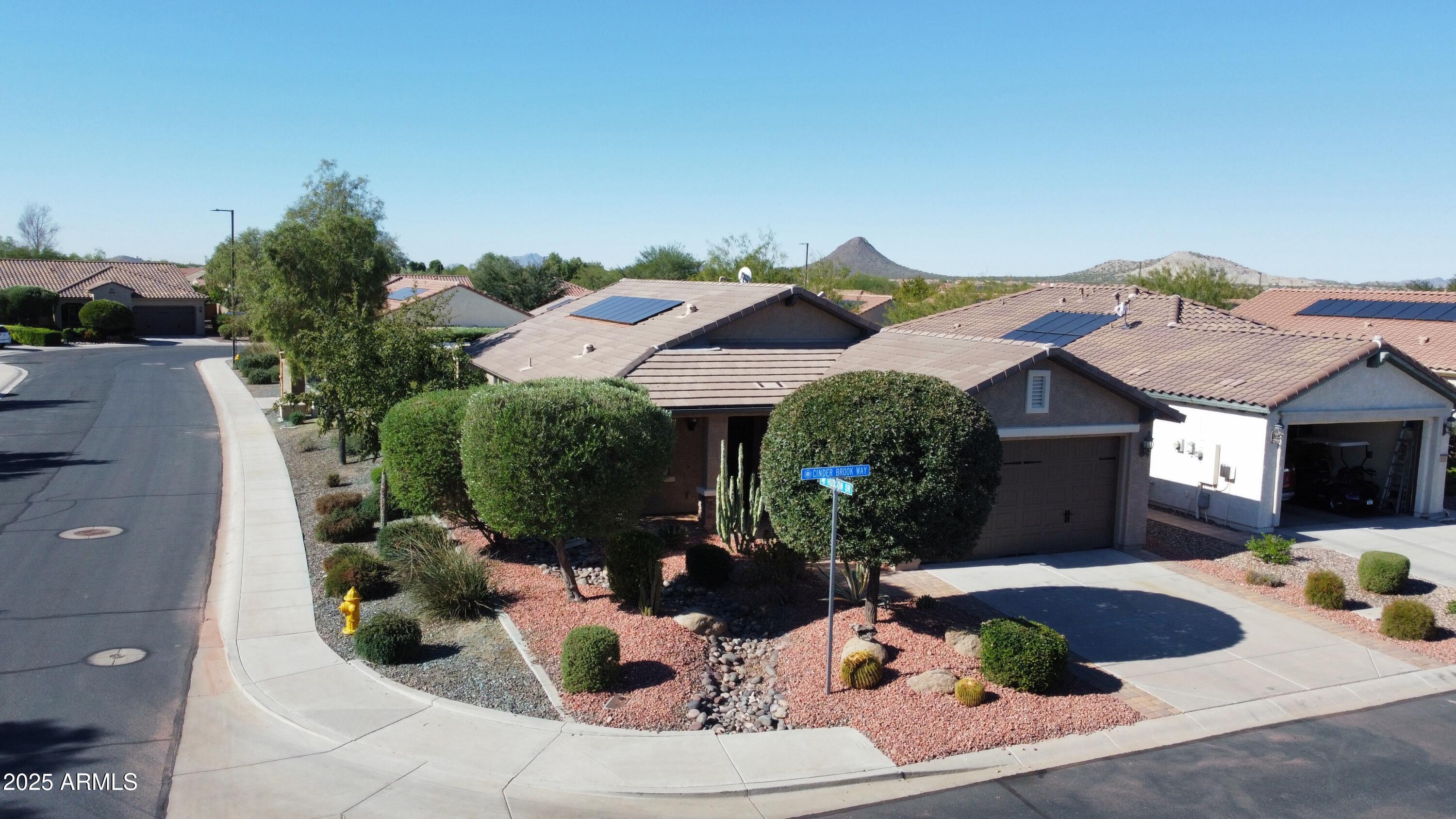7253 West Cinder Brook Way Florence, AZ 85132 - Photo 41 of 72 a view of a house with yard and sitting area