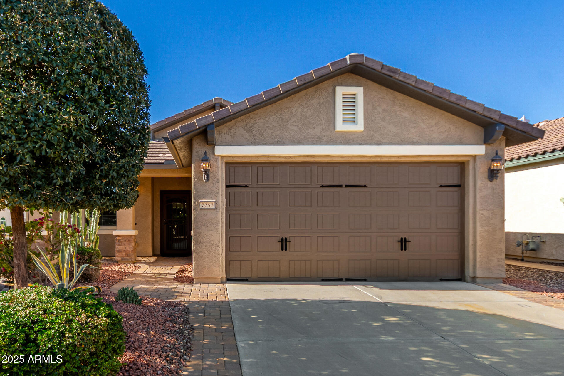 7253 West Cinder Brook Way Florence, AZ 85132 - Photo 42 of 72 a front view of a house with garage
