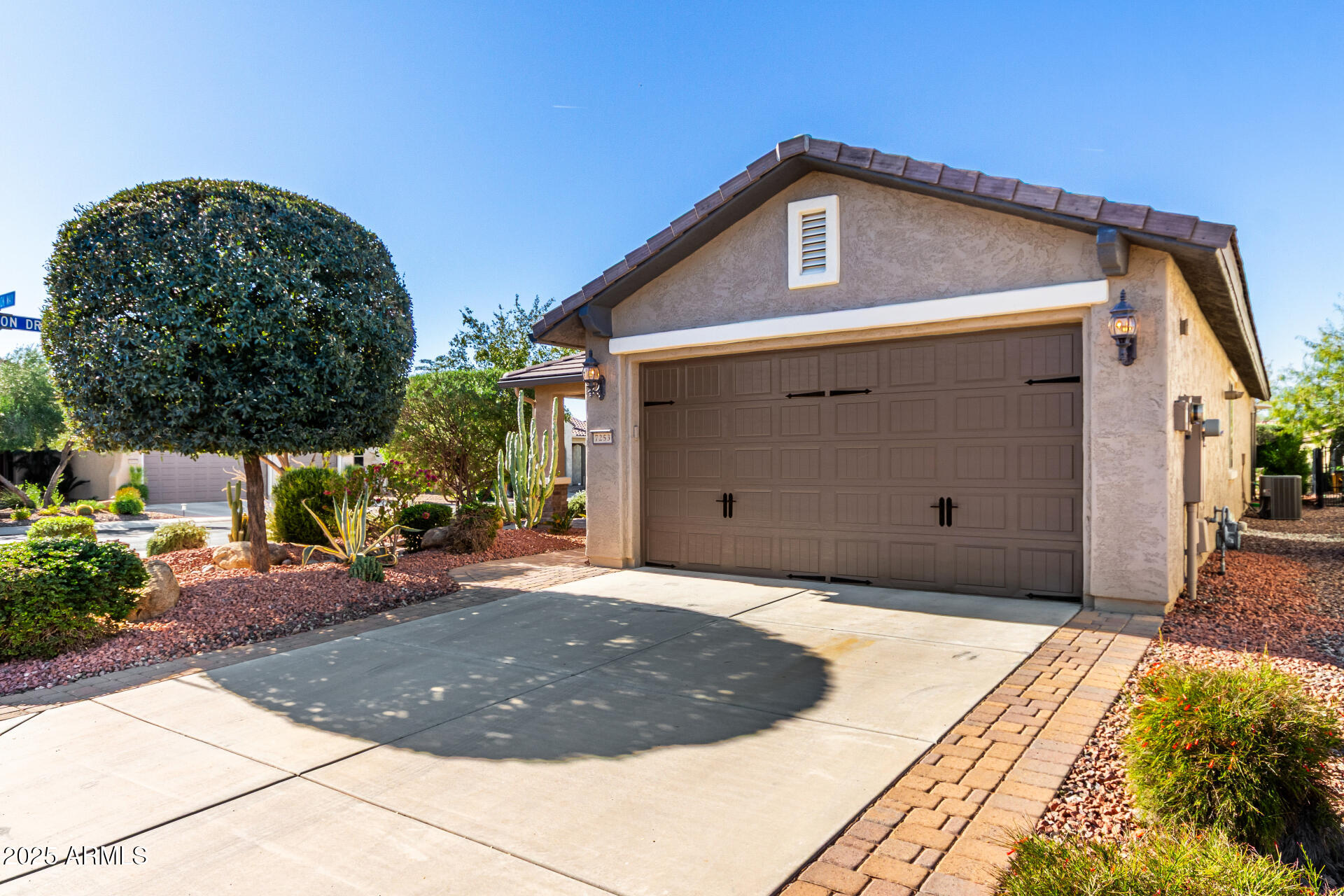 7253 West Cinder Brook Way Florence, AZ 85132 - Photo 46 of 72 a front view of a house with a yard