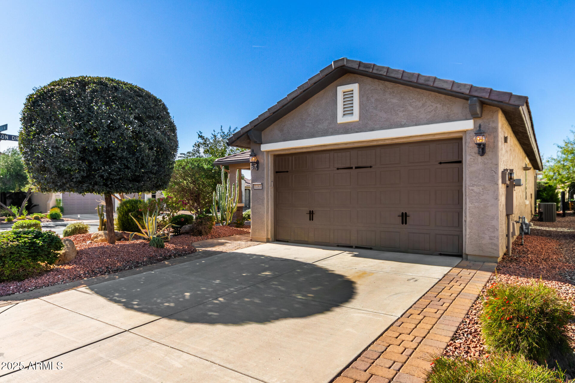 7253 West Cinder Brook Way Florence, AZ 85132 - Photo 7 of 72 a front view of a house with a yard