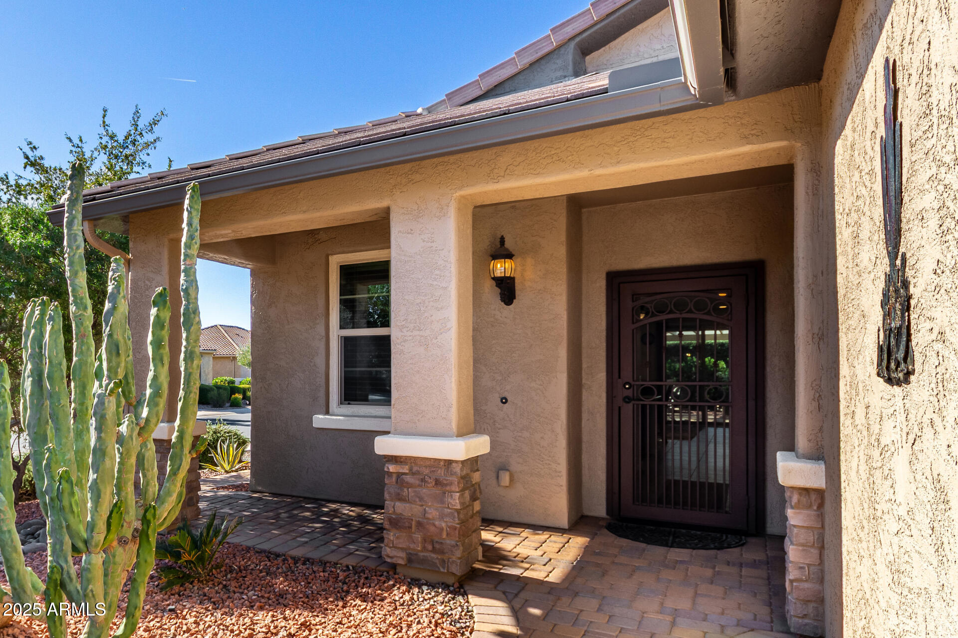 7253 West Cinder Brook Way Florence, AZ 85132 - Photo 10 of 72 a front view of a house with a porch