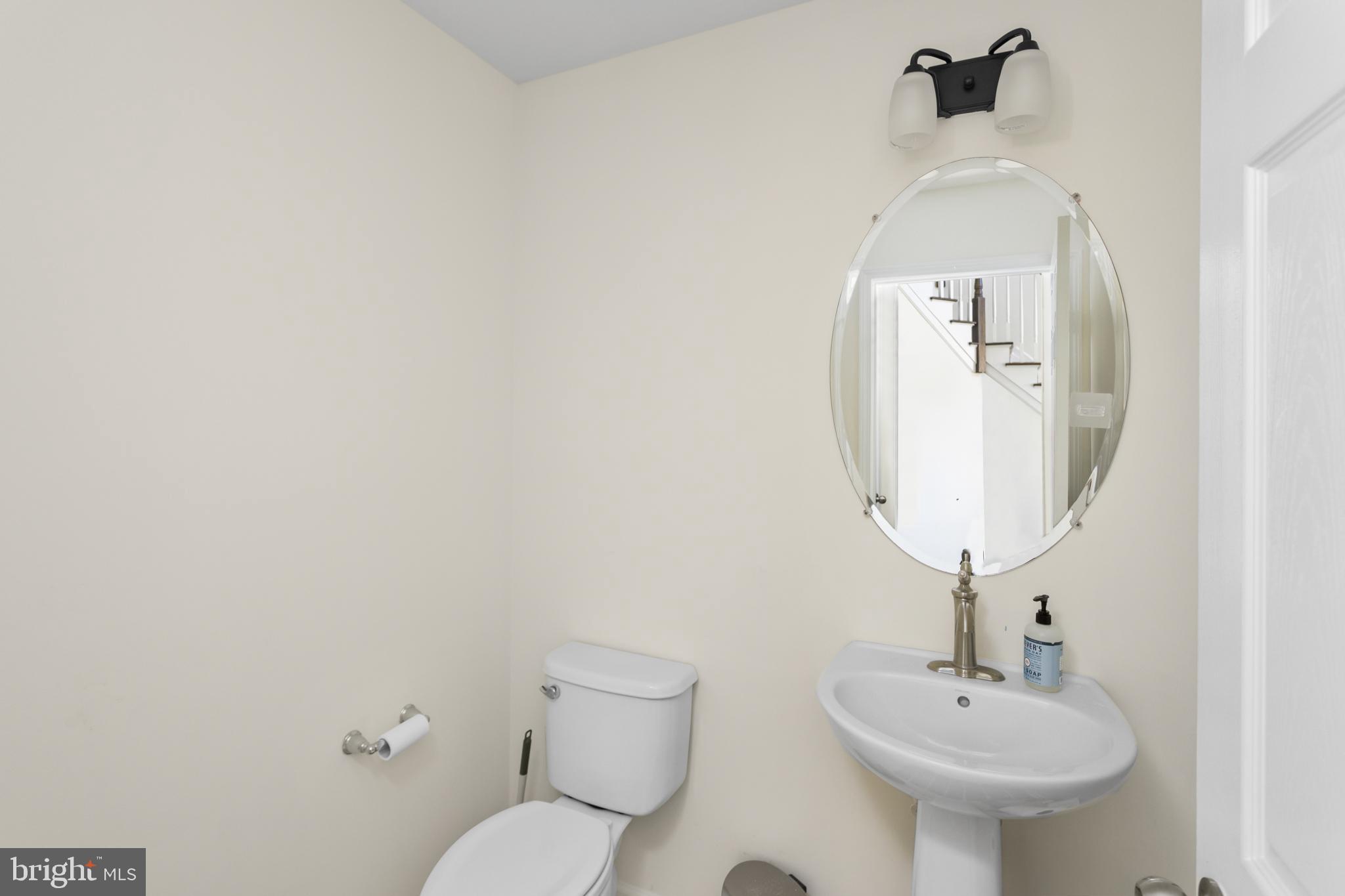 36 Brookdale Way Chesterfield, NJ 08515 - Photo 21 of 52 a bathroom with a toilet sink and mirror