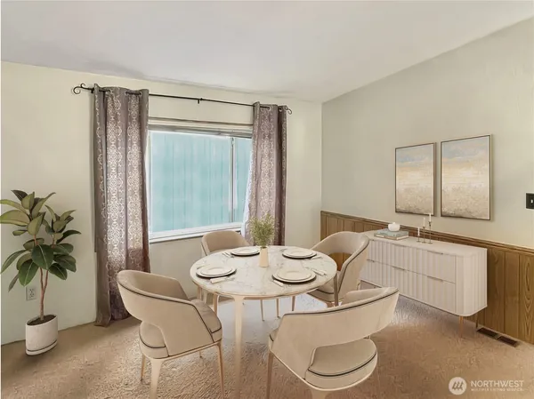 a dining room with furniture and window