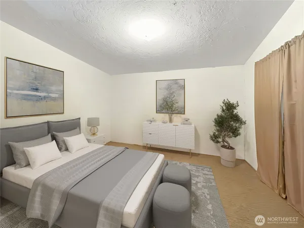 a bedroom with a bed and a painting on the wall