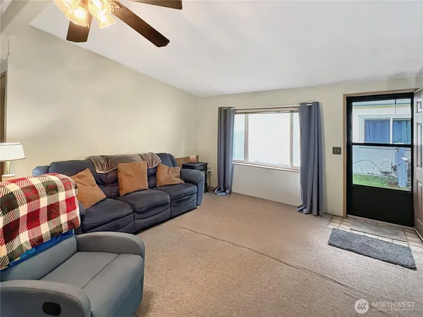 a living room with a couch and a window
