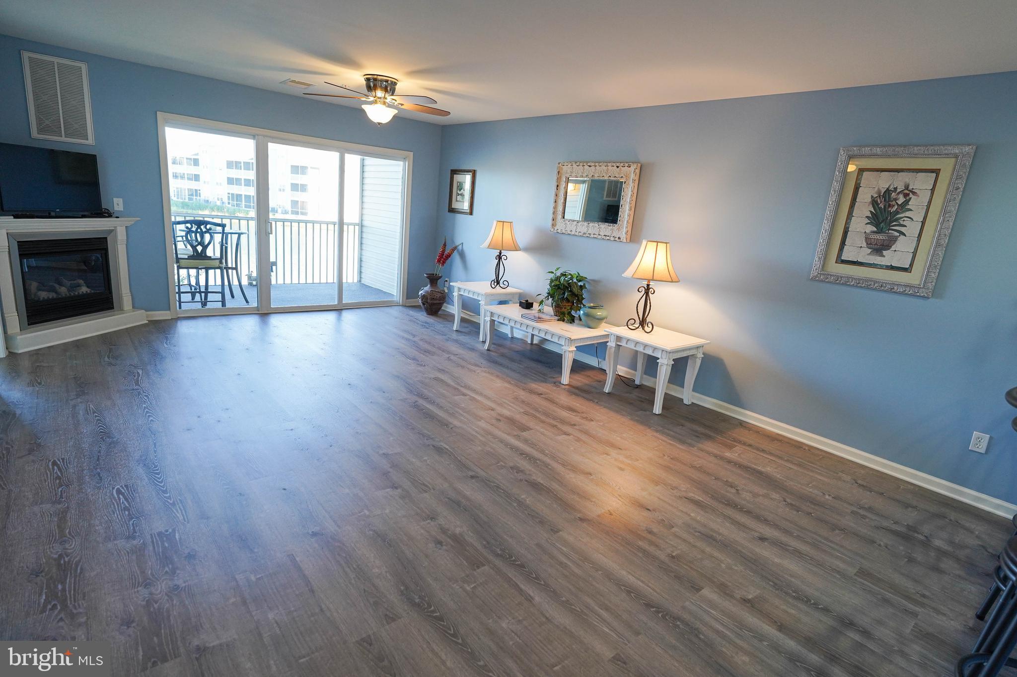 37182 Harbor Drive, Unit 264 Ocean View, DE 19970 - Photo 11 of 55 a living room with furniture and a fireplace