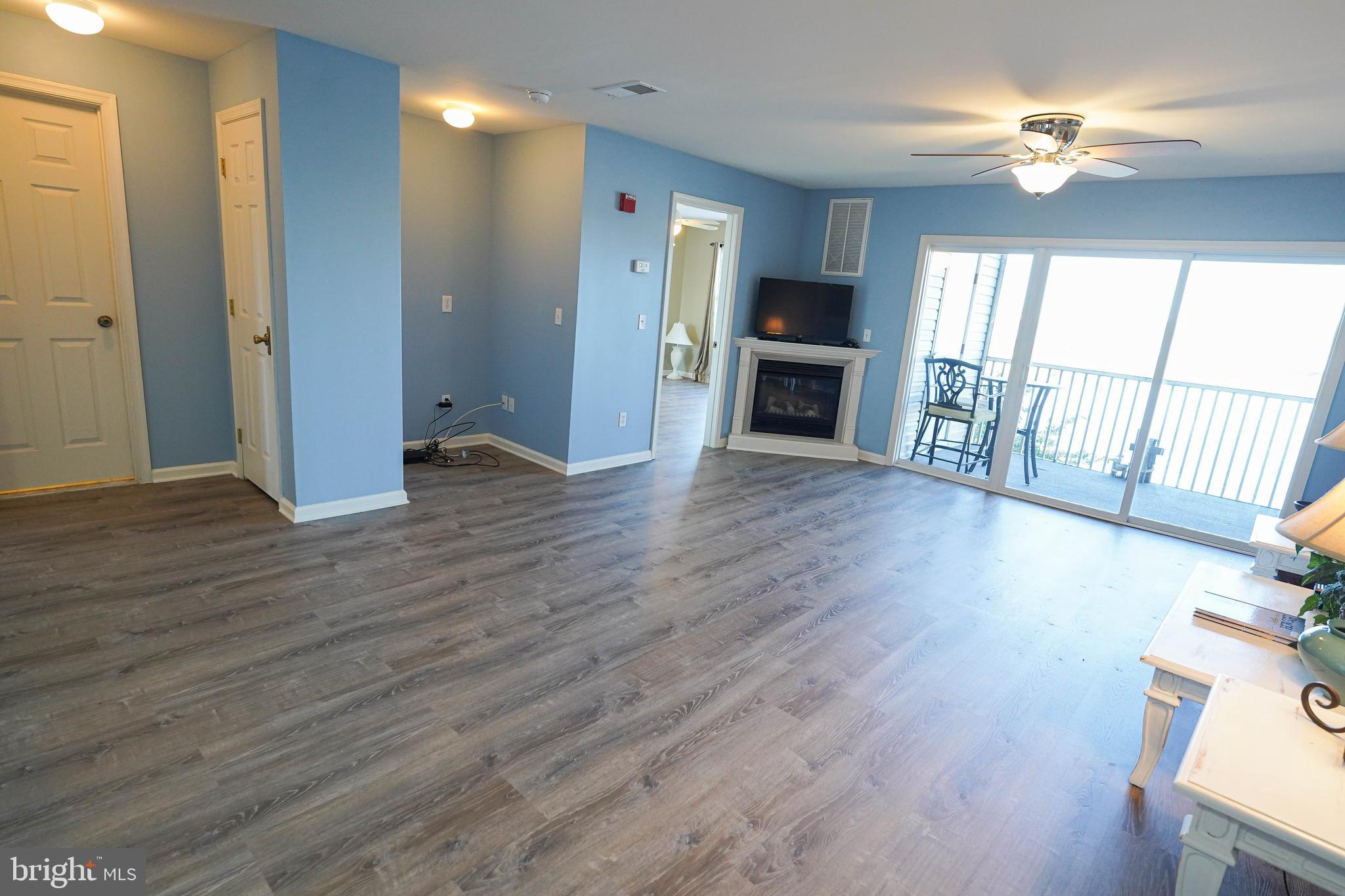 37182 Harbor Drive, Unit 264 Ocean View, DE 19970 - Photo 12 of 55 wooden floor in an empty room with a window