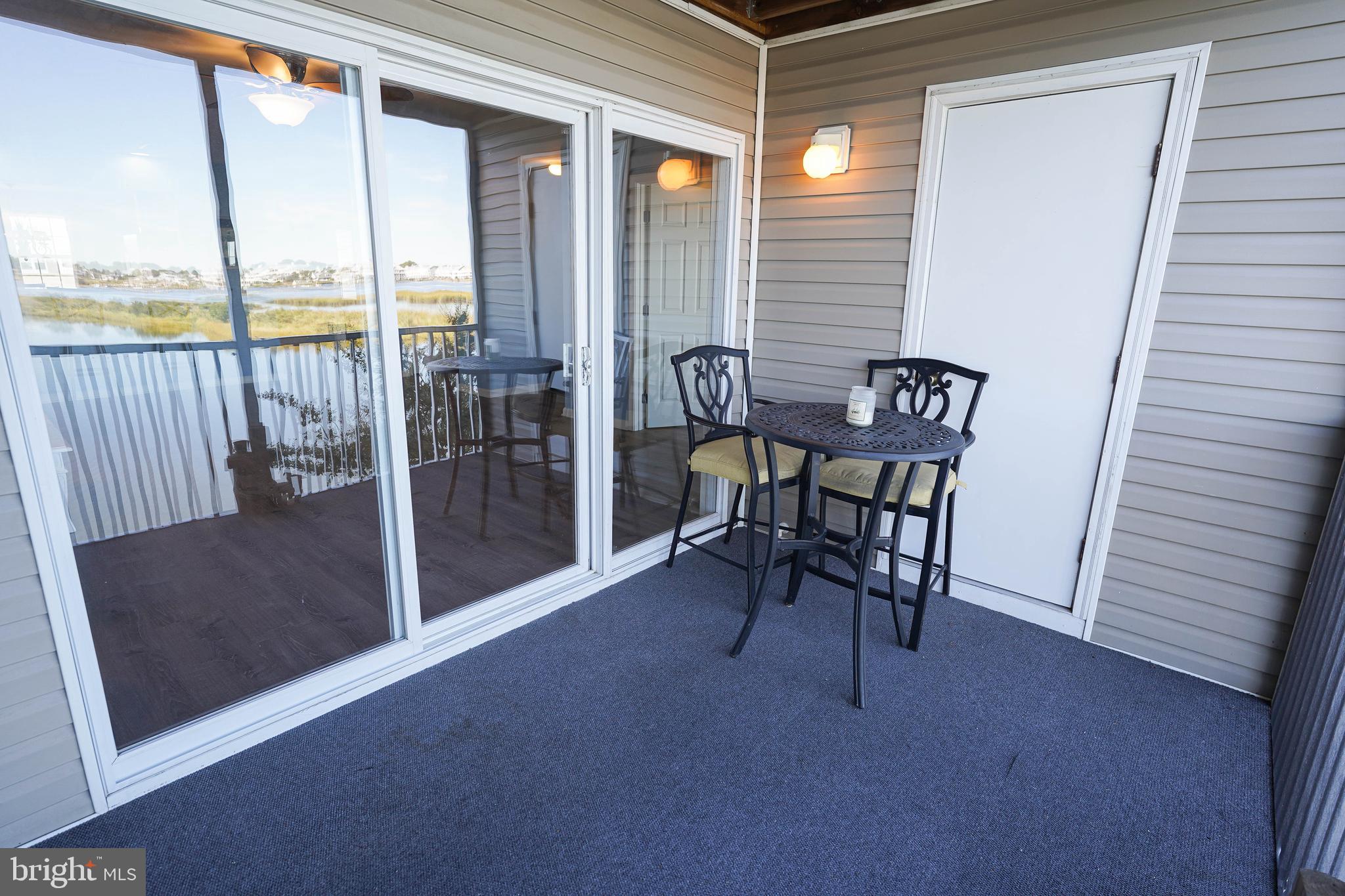 37182 Harbor Drive, Unit 264 Ocean View, DE 19970 - Photo 16 of 55 a view of a room with furniture and floor to ceiling window