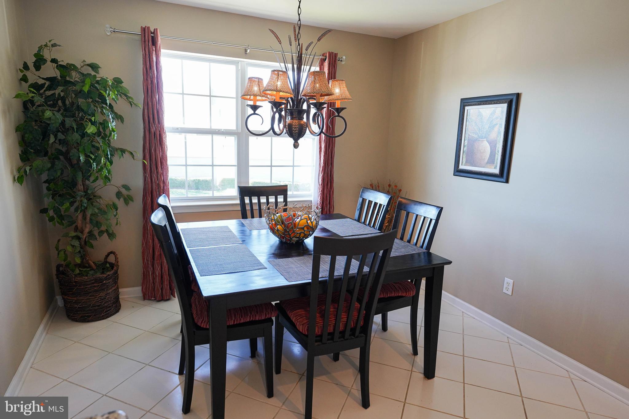 37182 Harbor Drive, Unit 264 Ocean View, DE 19970 - Photo 24 of 55 a view of a dining room with furniture and window
