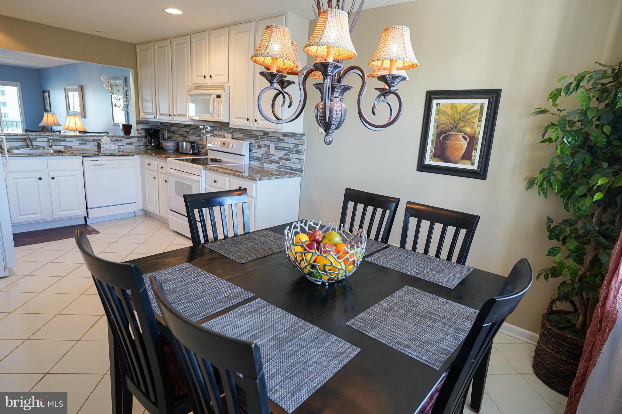 37182 Harbor Drive, Unit 264 Ocean View, DE 19970 - Photo 25 of 55 a view of a dining room with furniture and a chandelier